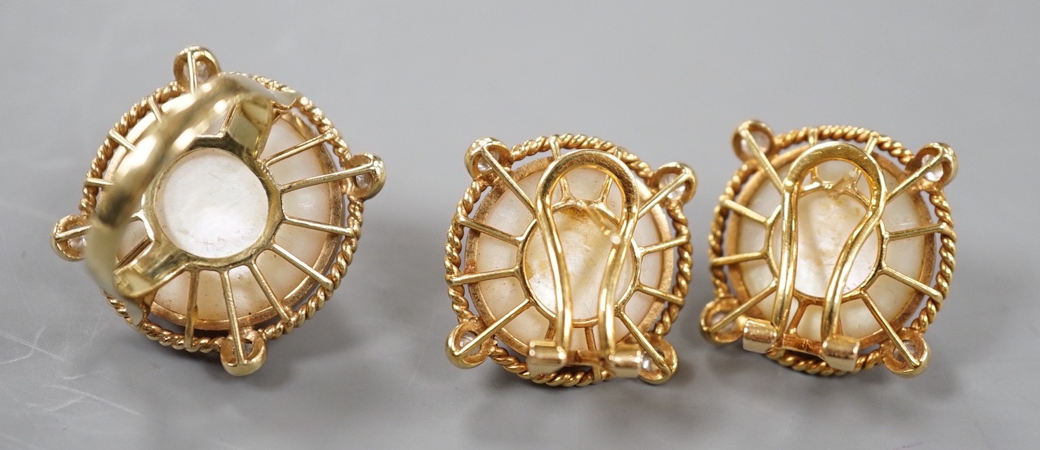 A yellow metal, mabe pearl and four stone diamond chip set dress ring, size H and a pair of similar earrings stamped 585 14k, gross weight 17.1 grams.
